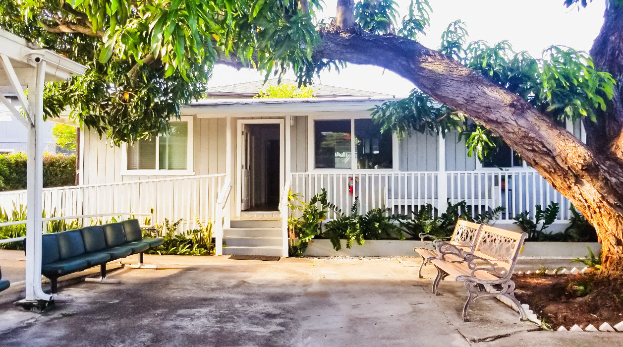 Courtyard under the mango tree with iron bench