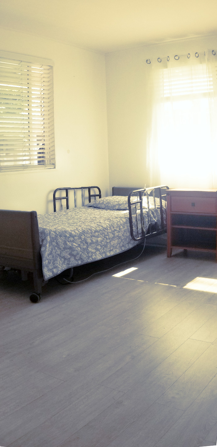 Resident bedroom with adjustable care bed