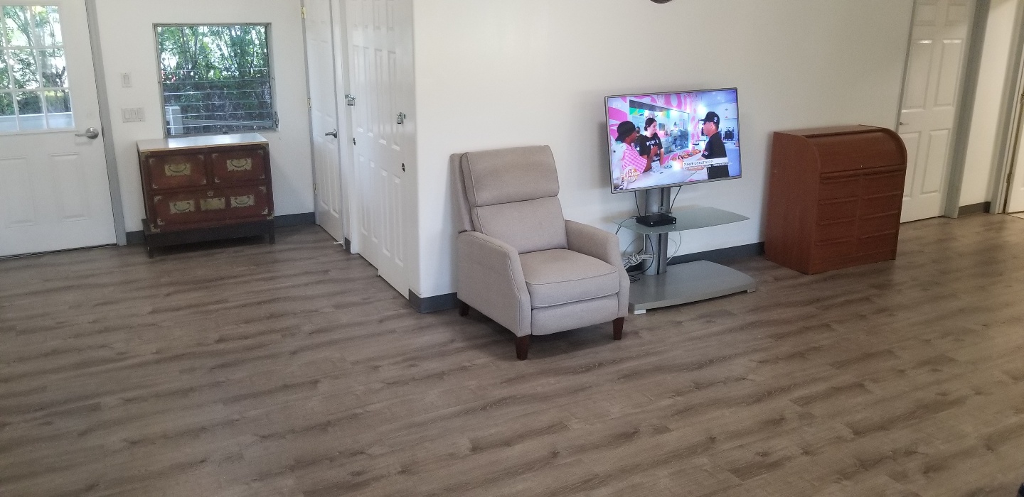 Common room with recliner and flat-screen TV
